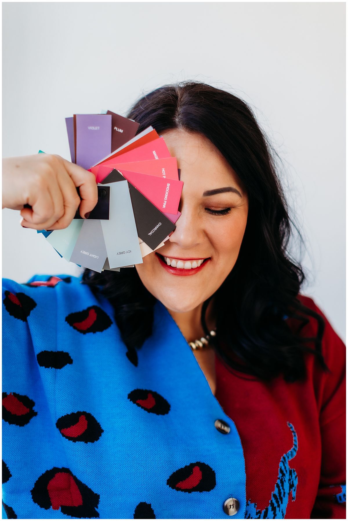Colour consultant holding fabric swatches
